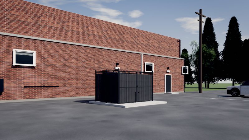 Black chain-link bin enclosure with privacy slats beside an apartment parking lot