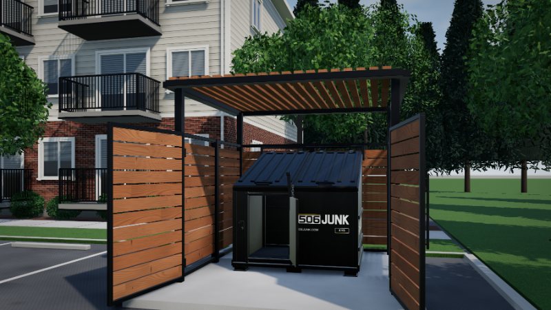 Modern enclosure with both gates open, showing a black 6 yard bin and its open crew door